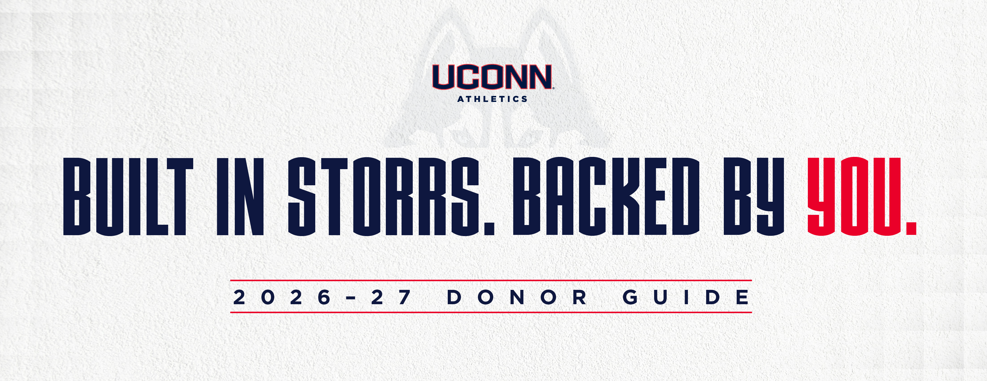 Cover of the 2026–27 UConn Athletics Donor Guide featuring the headline “Built in Storrs. Backed by You.” The UConn Athletics logo appears centered on a light textured background with red accent lines.